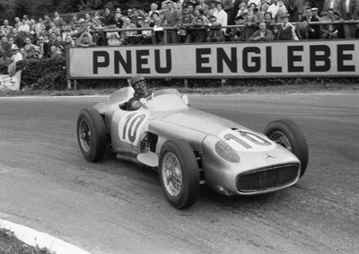 THE GREAT JUAN MANUEL FANGIO WORKING A NARROW BODIED W196 VERY HARD. JUST LOOK AT THE EXPRESSION ON HIS FACE!