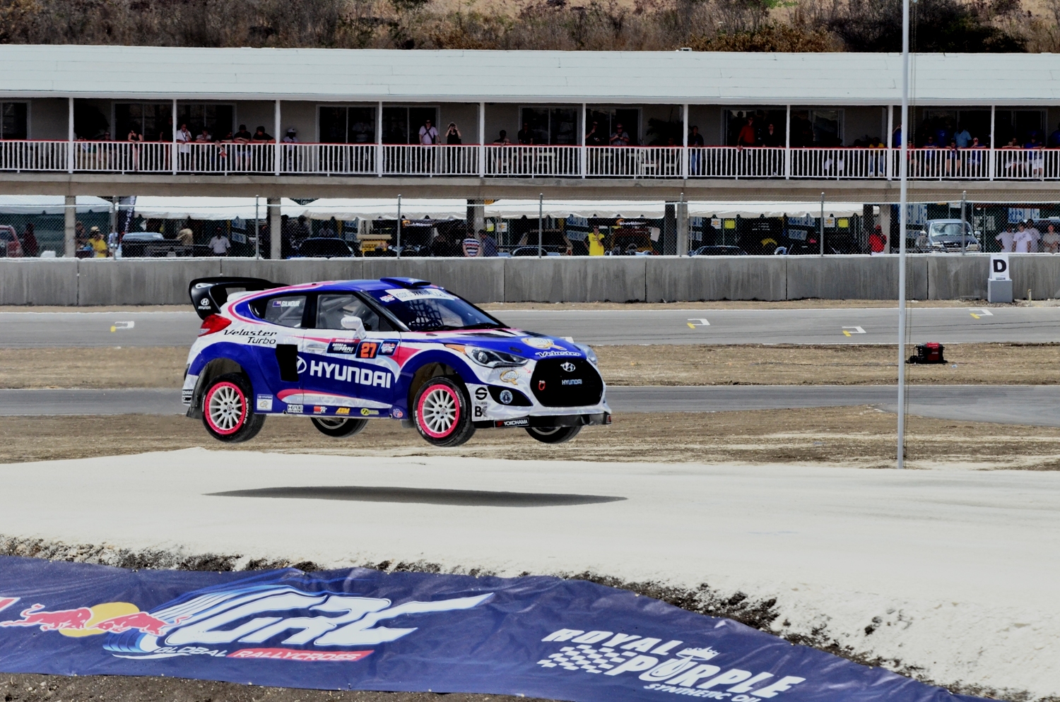New Zealand’s Emma Gilmour flies over a jump in her Rhys Millen Racing Hyundai Veloster Turbo at the Red Bull Global Rallycross Championship’s (GRC) first round in Barbados this weekend. Photo credit Nigel Browne.