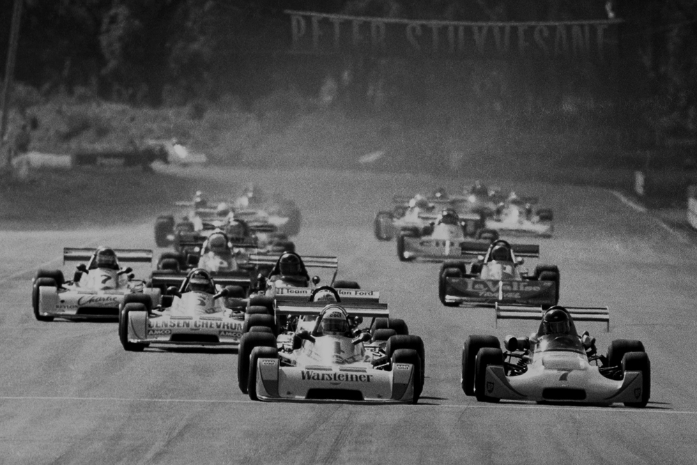 Manfeild 1977. Peter Stuyvesant Formula Pacific race. Keke Rosberg #4 leads out from Tom Gloy #7. IMAGE/terry marshall