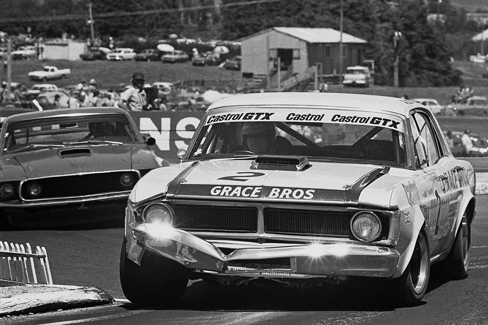 Pukekohe 1973. The days of the BIG BANGER saloon challenges. Pete Geoghegan's battered Ford Falcon leads fellow Australian Allan Moffat's Ford Mustang out of Pukekohe's top chicane. IMAGE/terry marshalll