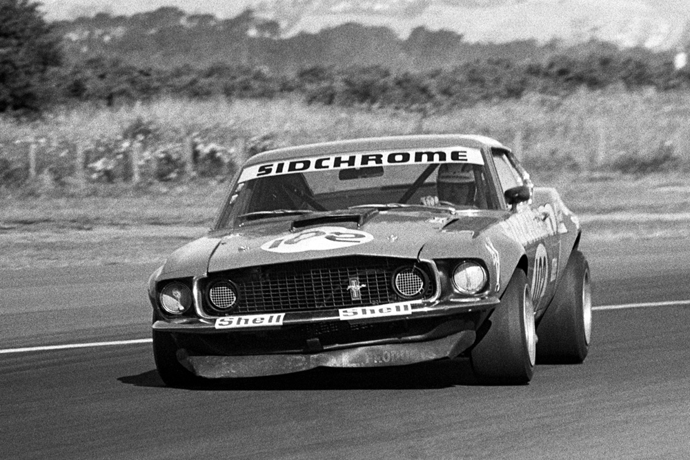 Wigram 1974. Jim Richards in the Sidchrome Ford Mustang captured turning into Bomb Bay corner during his epic battle with Allan Moffats Ford Mustang. IMAGE/terry marshall