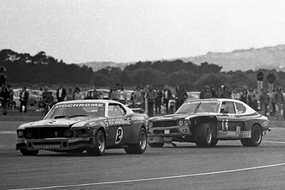 Wigram 1975. Jim Richards Sidchrome Mustang and Paul Fahey, Cologne Capri exit the hairpin during the Tin Top race of the decade. IMAGE/terry marshall