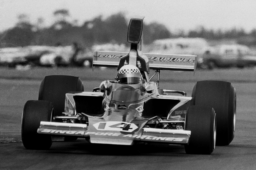Wigram 1974. The Lady Wigram Trophy race. Graeme Lawrence pounds his Lola T332 over the bump around #7 hanger towards the loop. IMAGE/terry marshall