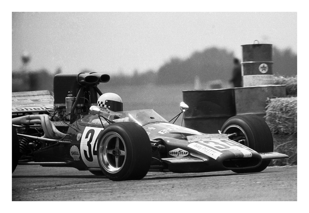 Wigram 1972. Teddy Pilette guides his McLaren M10B around the drums marking the loop and out onto Wigram's wide open track heading for Bomb Bay. IMAGE/terry marshall