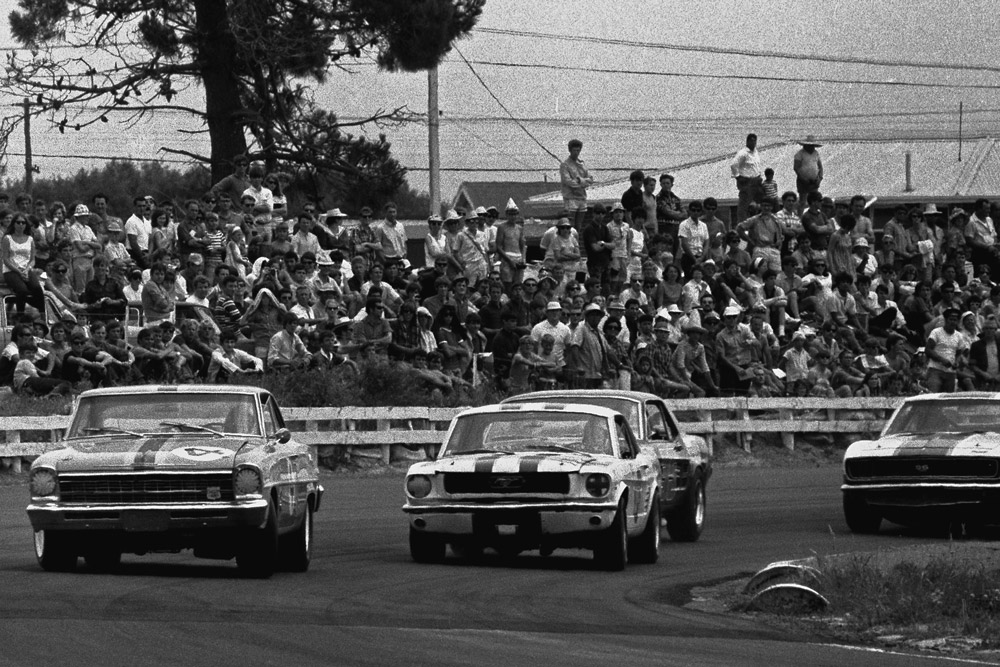 Paul Fahey and Red Dawson’s Ford Mustangs. Spinner Black's Chevrolet Camaro about to join in the action. IMAGE/terry marshall