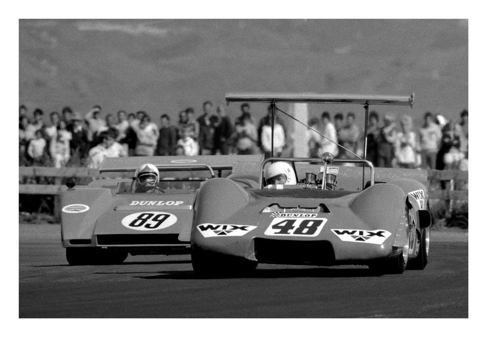 BayPark 1971. The days of the big engined sports cars. Grahame Harvey Elfin MR5 leading from Gary Pedersens GEMCO. IMAGE/terry marshall