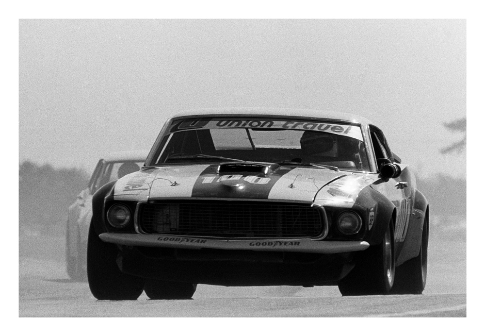 Levin 1975. Allan Moffat's Mustang in Union Travel colours turning into Levin's infield hairpin bend. IMAGE/terry marshall